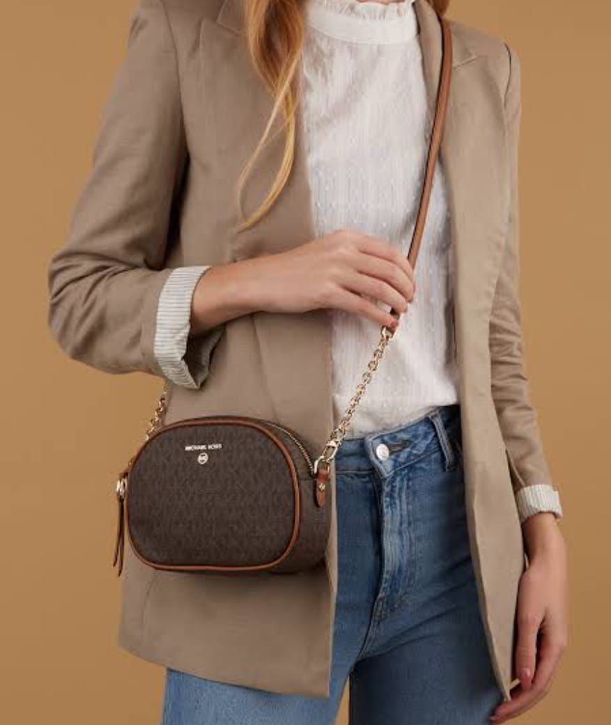 Jet set charm sling bags