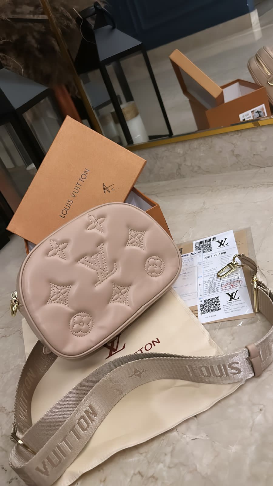 LV camera sling bag