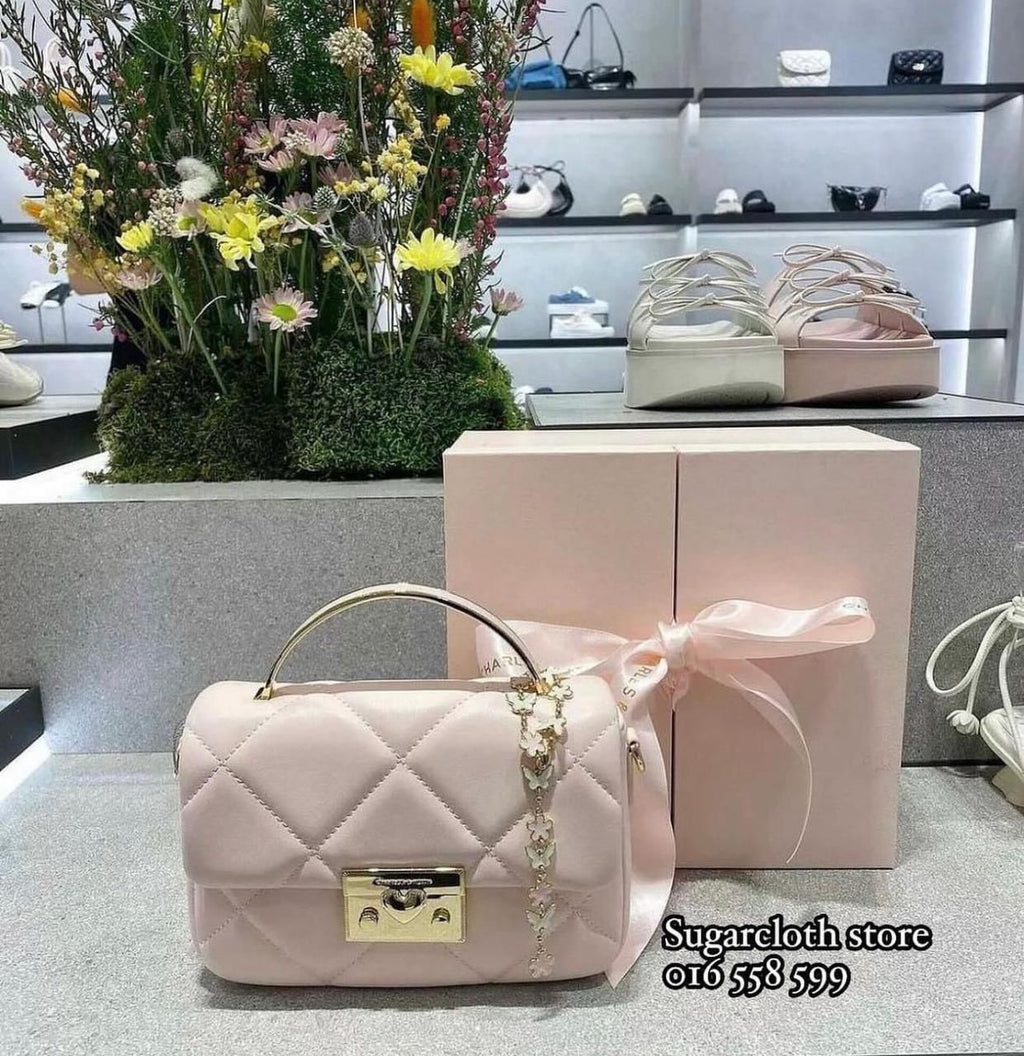 C&K boxy quilted top handle bag