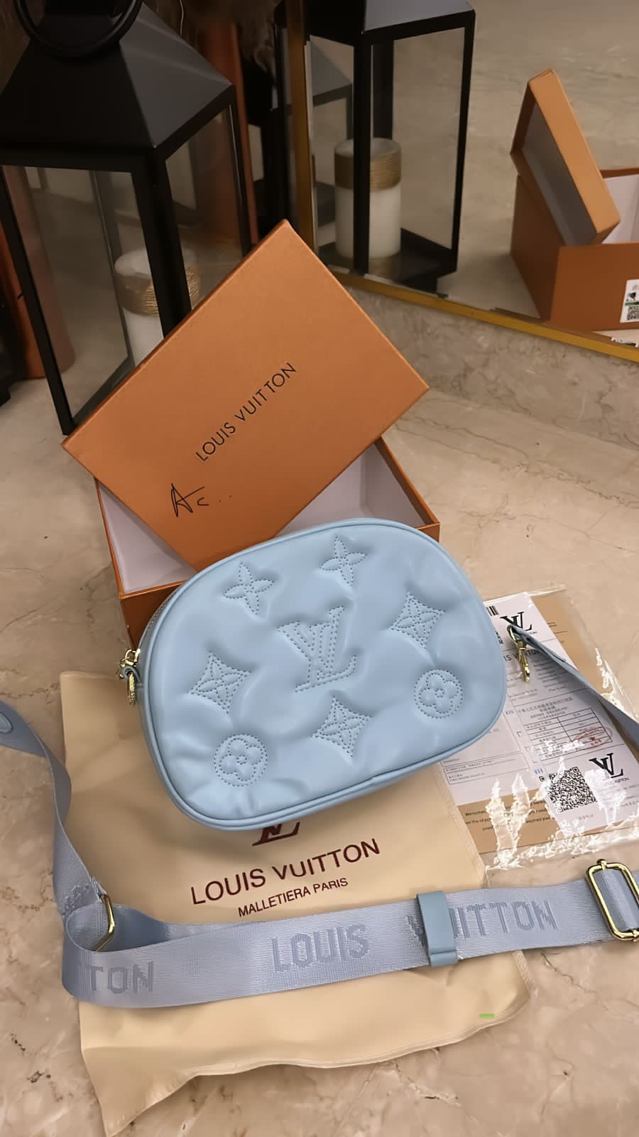 LV camera sling bag