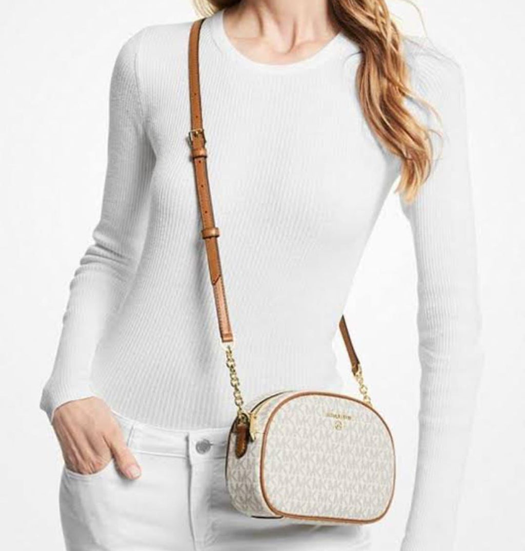 Jet set charm sling bags