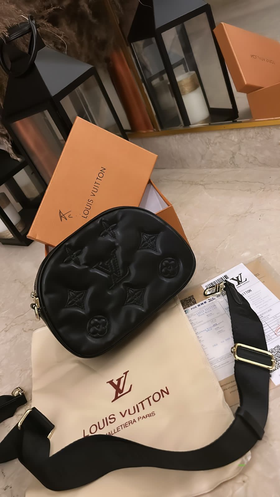 LV camera sling bag